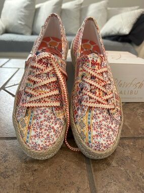 Never worn Blowfish Malibu sneakers. Snazzy look similar to espadrilles.